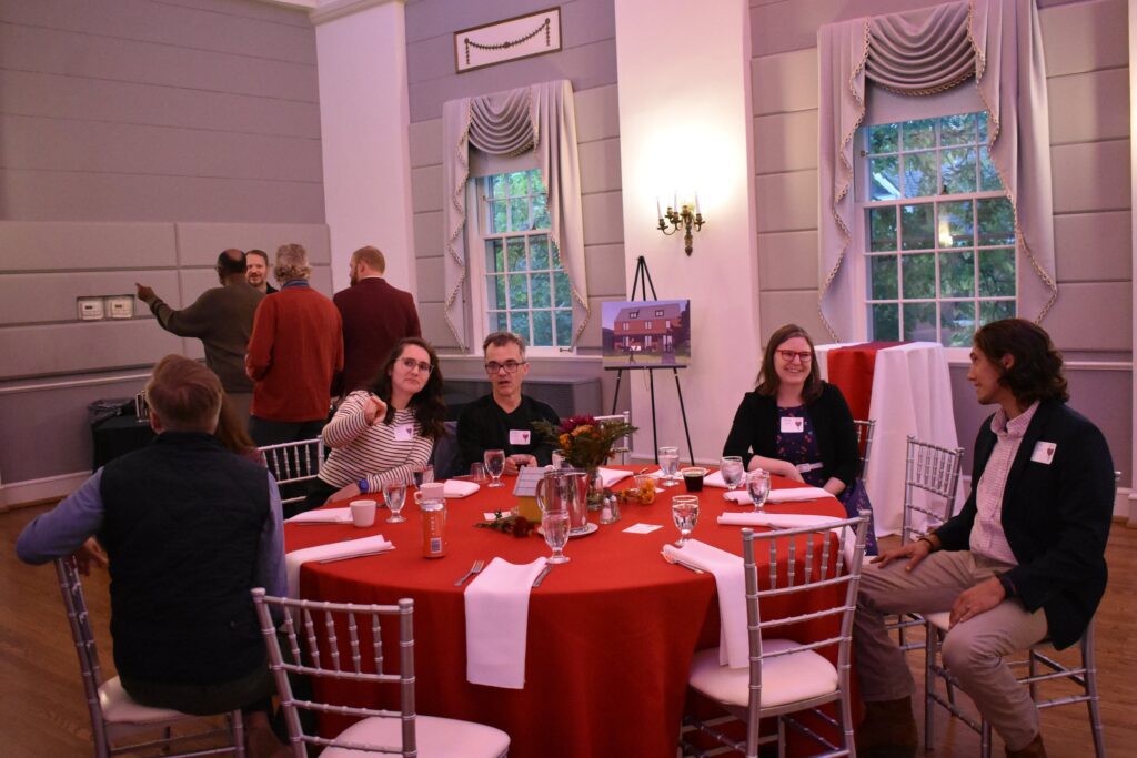 L'Arche benefit volunteers and members at the dinner table