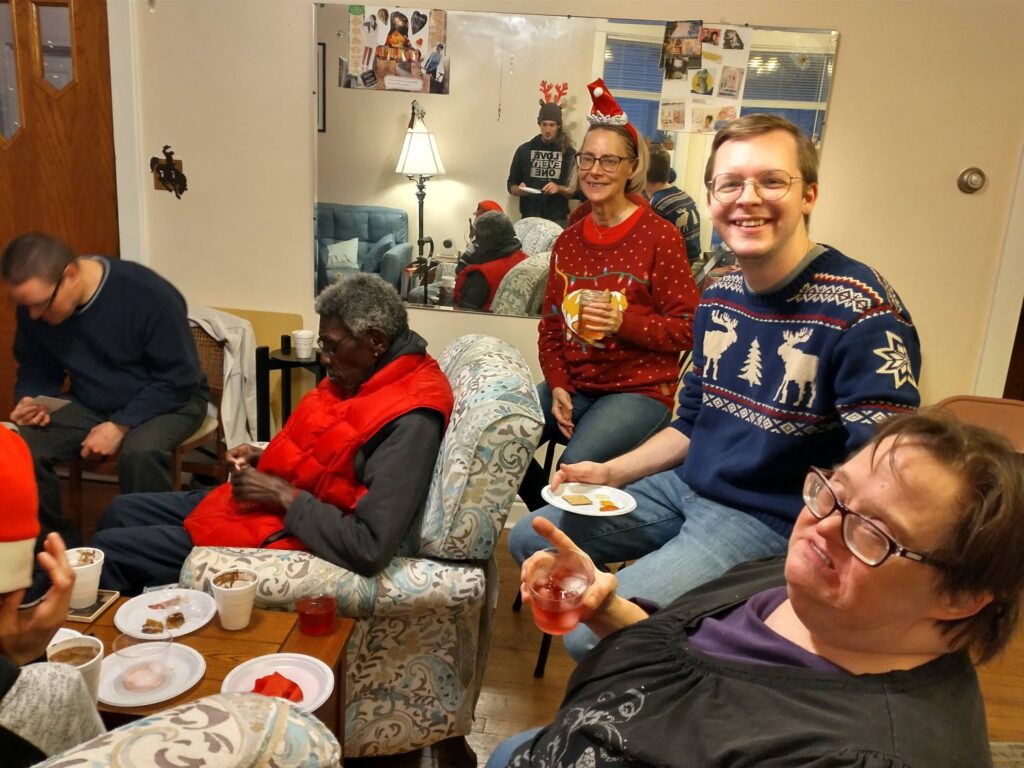L'Arche members and neighbours at Christmas time socializing