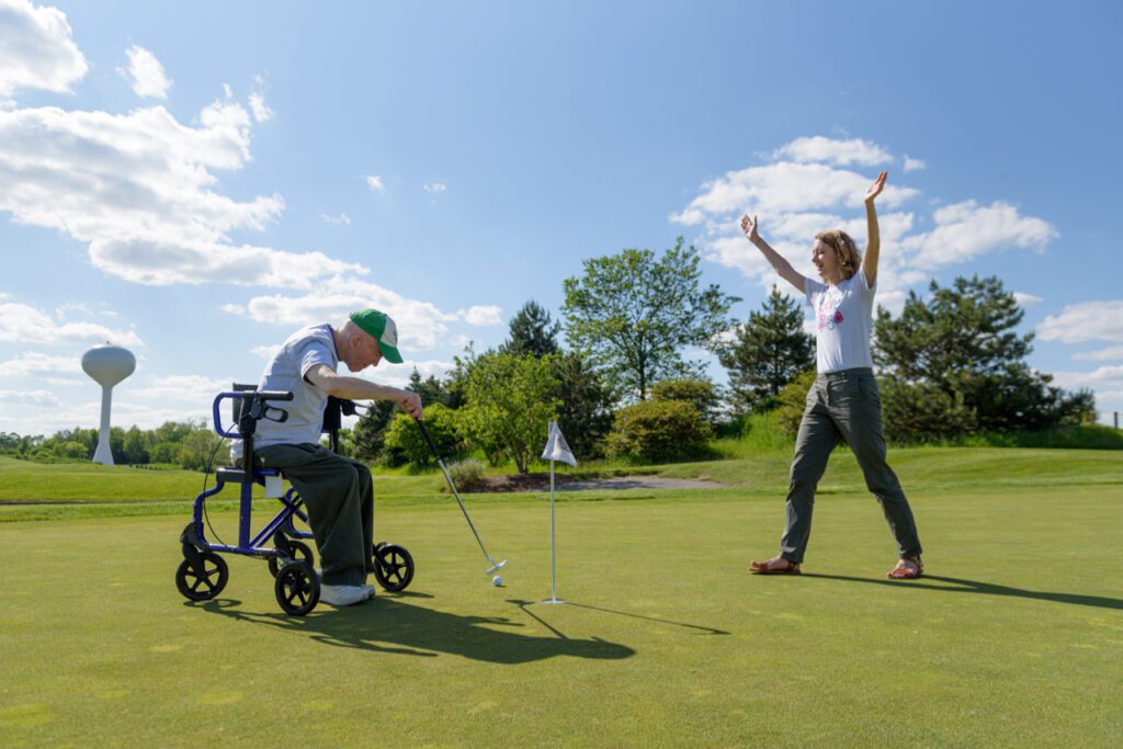 L'Arche Member makes a hole in one at the L'Arche Chicago 2019 Golf Event